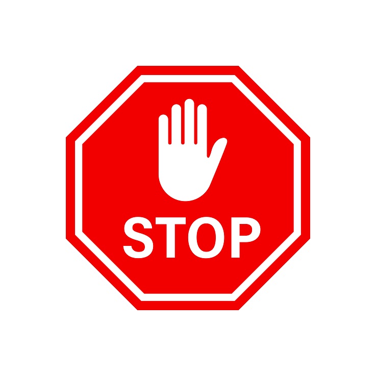 Stop sign with a hand inserted into it.